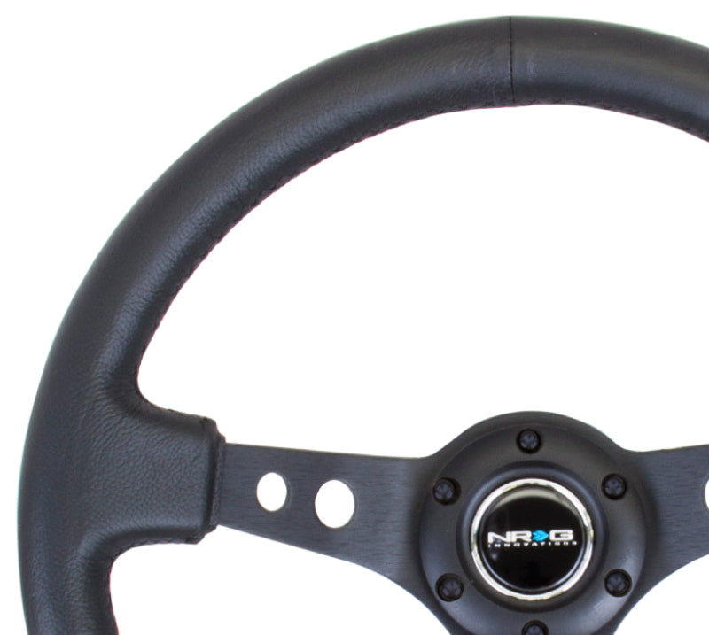 NRG Reinforced Steering Wheel (350mm / 3in. Deep) Blk Leather w/Blk Spoke & Circle Cutouts - 0