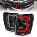 ANZO 1999-2004 Jeep Grand Cherokee LED Tail Lights w/ Light Bar Black Housing Clear Lens-1