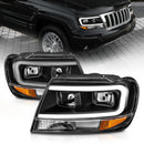 ANZO 99-04 Jeep Grand Cherokee Crystal Headlights - w/ Light Bar Black Housing-1